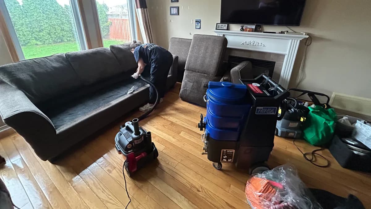 Professional portable extraction machines set up in a living room